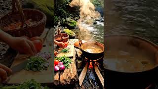 Outdoor cooking beside a clear flowing river in the middle of nature #cooking #nature #ai #outdoors