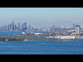 Expansive cityscape of Toronto's downtown core featuring the Billy Bishop City Airport with aircraft