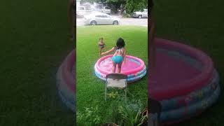 Little Girls Playing In Pool