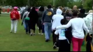 People brave the cold rain to walk against cancer