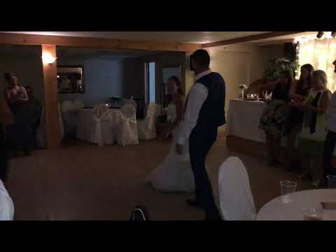 Bride and groom surprise guests with The Git Up dance