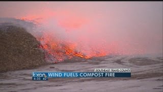 High winds fuel compost fire