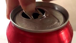 The proper way to open a Coca Cola can