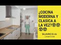 Cocina moderna blanca puerta enmarcada lacada con tirador negro y encimera laminada