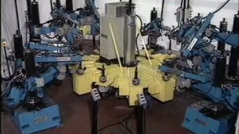 CNC rotary table machine for grinding and linishing of plumbing components.