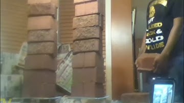 Kid tries to stack bricks on glass table Gone wrong