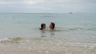 Mother And Daughter Swim In Sea Water