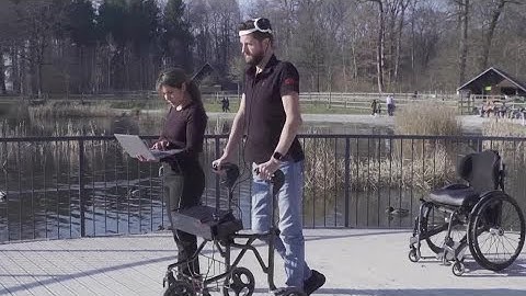 Paralyzed man walks again with brain-spine device