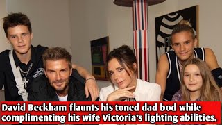 David Beckham flaunts his toned dad bod while complimenting his wife Victoria's lighting abilities.