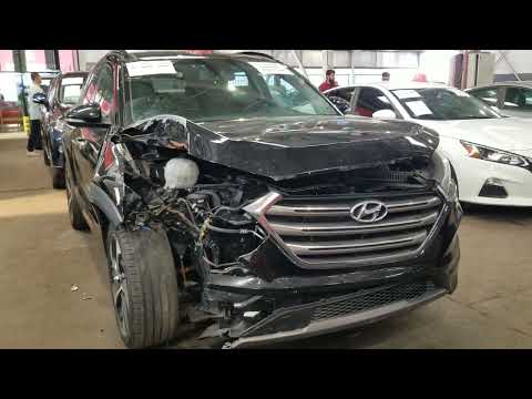 Wrecked cars at an auction site