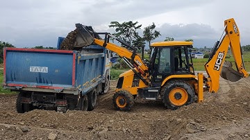 JCB Machine Loading Gravel in Dump Truck - JCB Backhoe and Tata Truck Working on Sandy Place