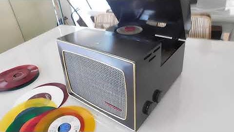 RCA 45 RPM record player, bakelite case playing a stack or 45