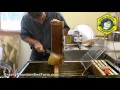 Uncapping a Frame of Honey with a Cold Knife