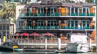 Promenade and restaurants timelapse at the Marina walk, During day time. Dubai, UAE