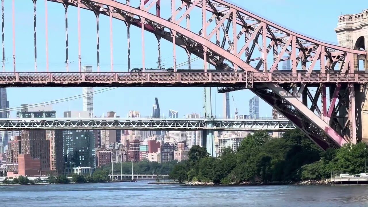 Southbound Amtrak NE Regional on the Hell Gate Bridge riding on its way to Penn Station