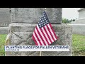 Planting flags for veterans leading into Memorial Day weekend
