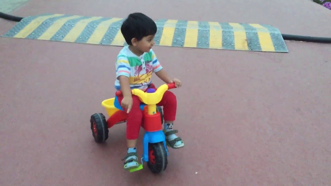 kids riding tricycles