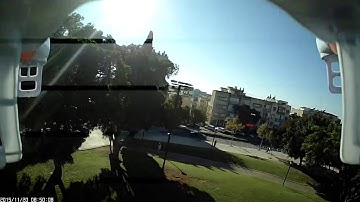 Syma X5C carrying 808 #16 keychain camera (808 purchased from Banggood.com)