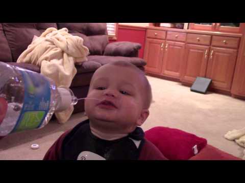 Cute toddler hilariously drinks his water