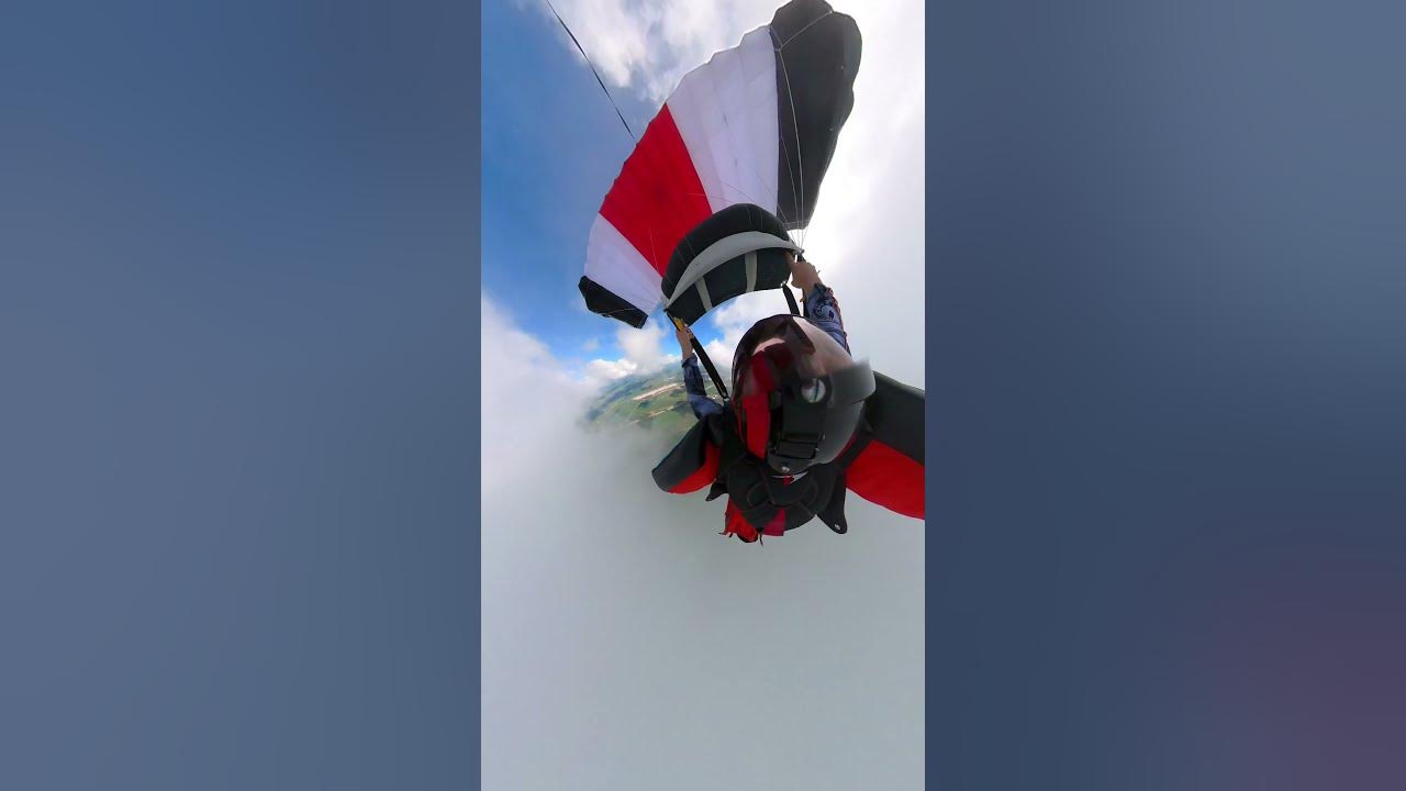 Wingsuit Skydiver Maneuver around the Clouds to Avoid Going Inside