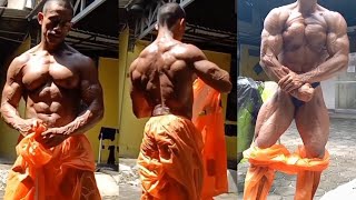 Indonesian bodybuilder is sunbathing, sweating and showing off his muscles