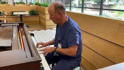 Dr. Scott Millikan plays piano for patients