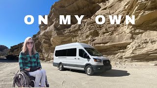 Wheelchair vanlifer explores a desert wash where 4x4 is recommended