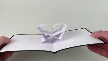 Pop-up flip mechanisms in opposite directions