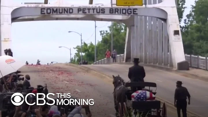 Civil rights icon Congressman John Lewis crosses E...