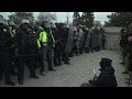 Police in riot gear stand guard outside Capitol | AFP