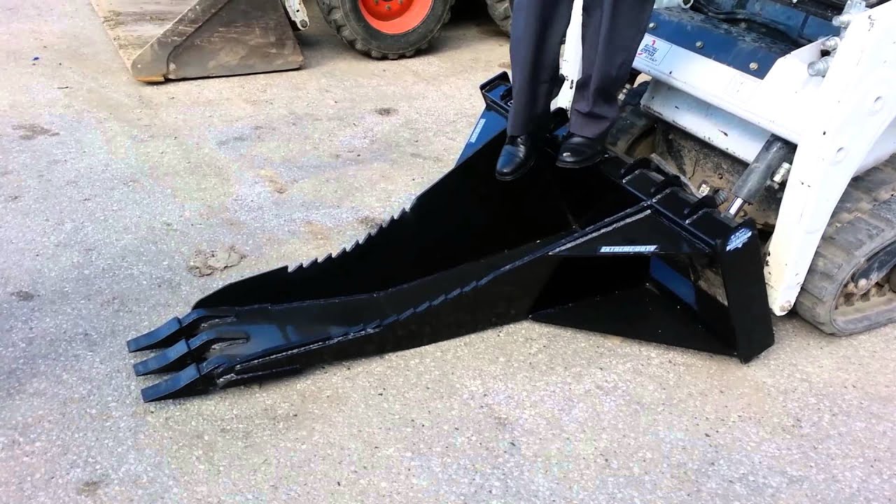 Bobcat T110 with a Stump Bucket. YouTube