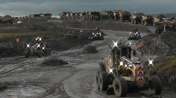 Caterpillar 14M Grader Working After the Rain