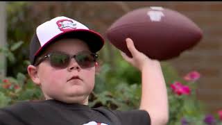 Local boy with rare genetic disorder throws first pitch at Akron Rubber Ducks game