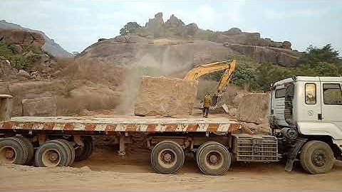 granite block loading on to a lorry