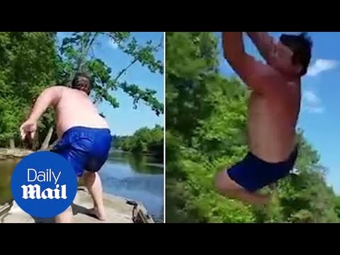 Man falls off moving boat as rope swing trick goes wrong