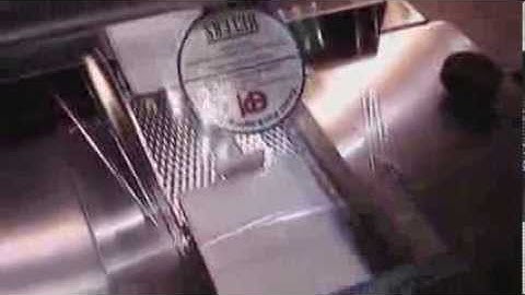 Horizontal Wrapper Labeler on Shrinkwrapped Products