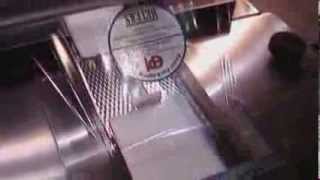 Horizontal Wrapper Labeler on Shrinkwrapped Products