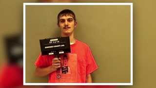 Man Poses for New Mugshot Photo Wearing Shirt with Old Mugshot Photo On It