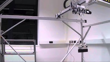 Tracking Controller Design for a Nonlinear Model of a Gantry Crane