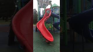 Boy goes down slide at park and faceplants on pavement