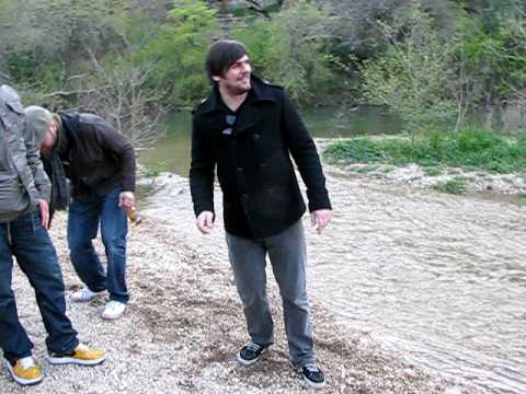 sxsw visitors skipping rocks on the greenbelt!