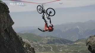Cyclist falls off tightrope over 120 metre drop in French Alps screenshot 4