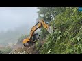Monsoon Rainy and Foggy Day Mountain Road Construction with JCB Excavator
