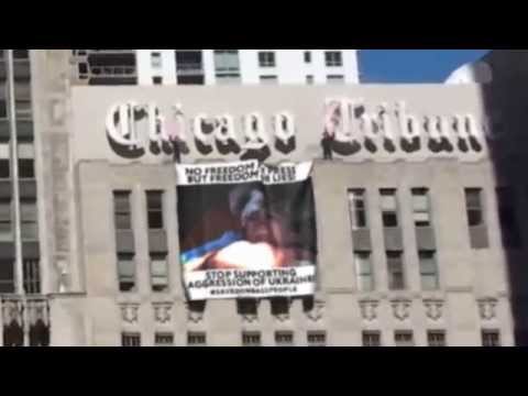 Unknown activists placed #savedonbasspeople banner on the Chicago Tribune Tower.{slow mo}  2015/5/19