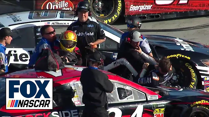 Daniel Suarez and Michael McDowell fight during Mo...