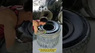The process of repairing a large truck tire using hand tools