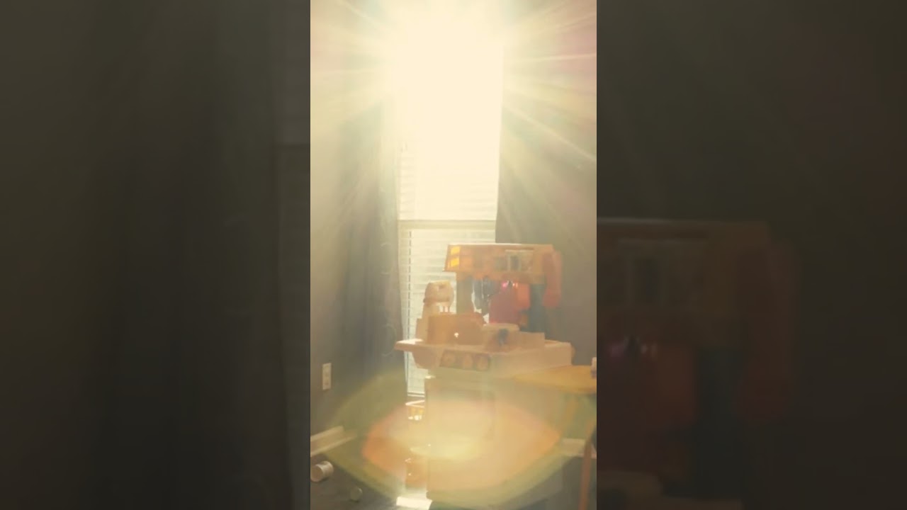 The Early Morning Sun Rays Peeking Through A Room Window