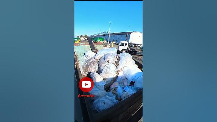 garbage truck dumping huge bin