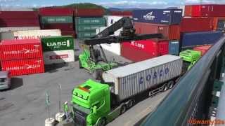 SMV 4535 TB5 Reach Stacker Unloads Containers From Trucks