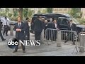 Hillary clinton aides assist her into van during 911 ceremony